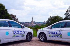 ABC branded taxis with Norwich skyline background